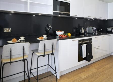 A full size kitchen for dining and safe meal preparation