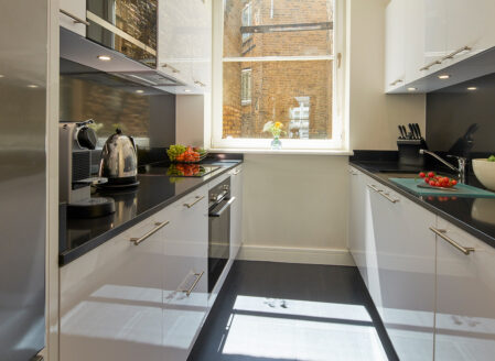 A full size kitchen for dining and safe meal preparation in a two bedroom apartment