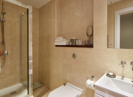The en-suite bathroom features complimentary toiletries