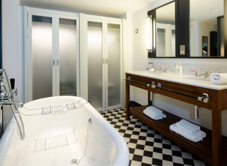 The bathroom in a luxury one-bedroom apartment with bed alcove 