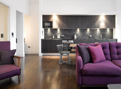 COTC Deluxe Three Bedroom Apartments - Living Area + Kitchen - 2