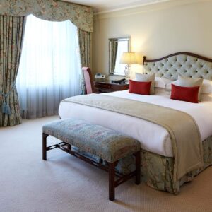 Spacious bedrooms are dressed with comfortable linens