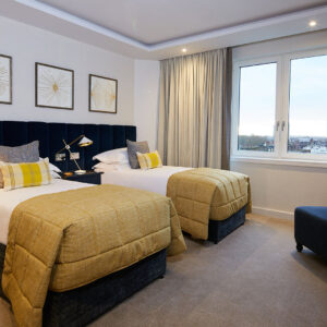 The third bedroom is configured with twin beds that can be linked on request. This bedroom also has an en-suite bathroom.