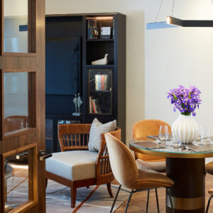 The open plan living space includes a dining area comfortably seating four people.