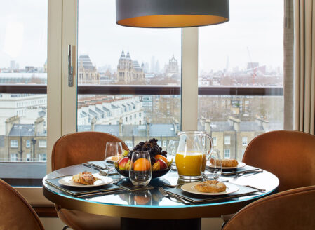 The open plan living area seats four at the dining table