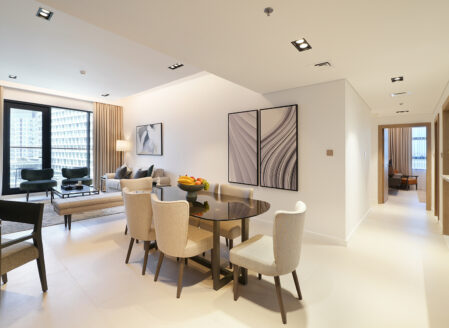 The open plan living and dining area features a sofa bed