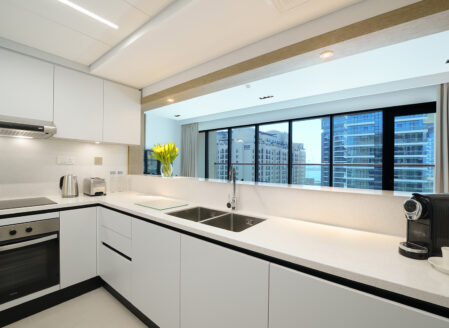 The fully equipped kitchen leading into the open plan area