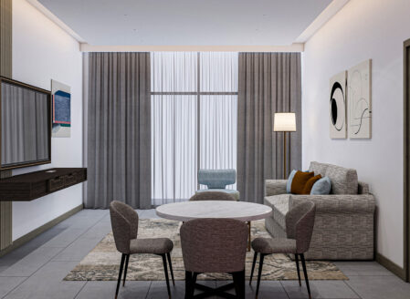 The open plan living and dining area features a sofa bed
