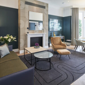A spacious living with a Racing Green décor
