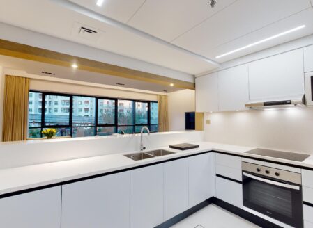 The fully equipped kitchen looks onto the open plan reception room