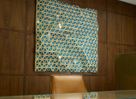 Hugo G Urrutia's work is visible behind the reception desk