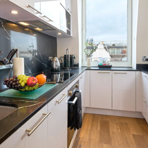 A full size kitchen for dining and safe meal preparation in a two bedroom apartment
