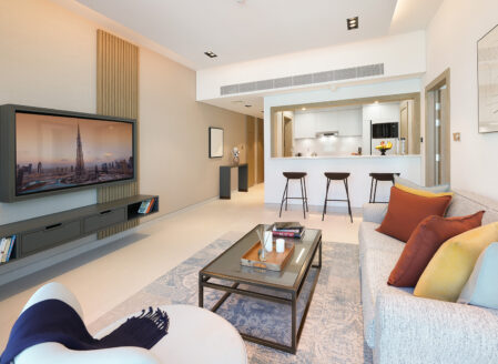 The spacious open plan living and dining area in a one-bedroom apartment