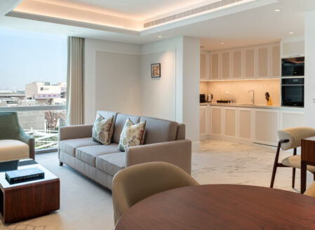 The open plan living area with fully-equipped kitchen