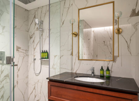 The first bathroom features a shower and complimentary luxury toiletries 
