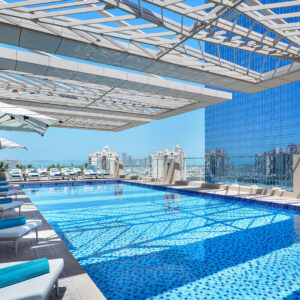 Panoramic views of the Palm Jumeirah from the roof top pool at Cheval Maison - The Palm Dubai